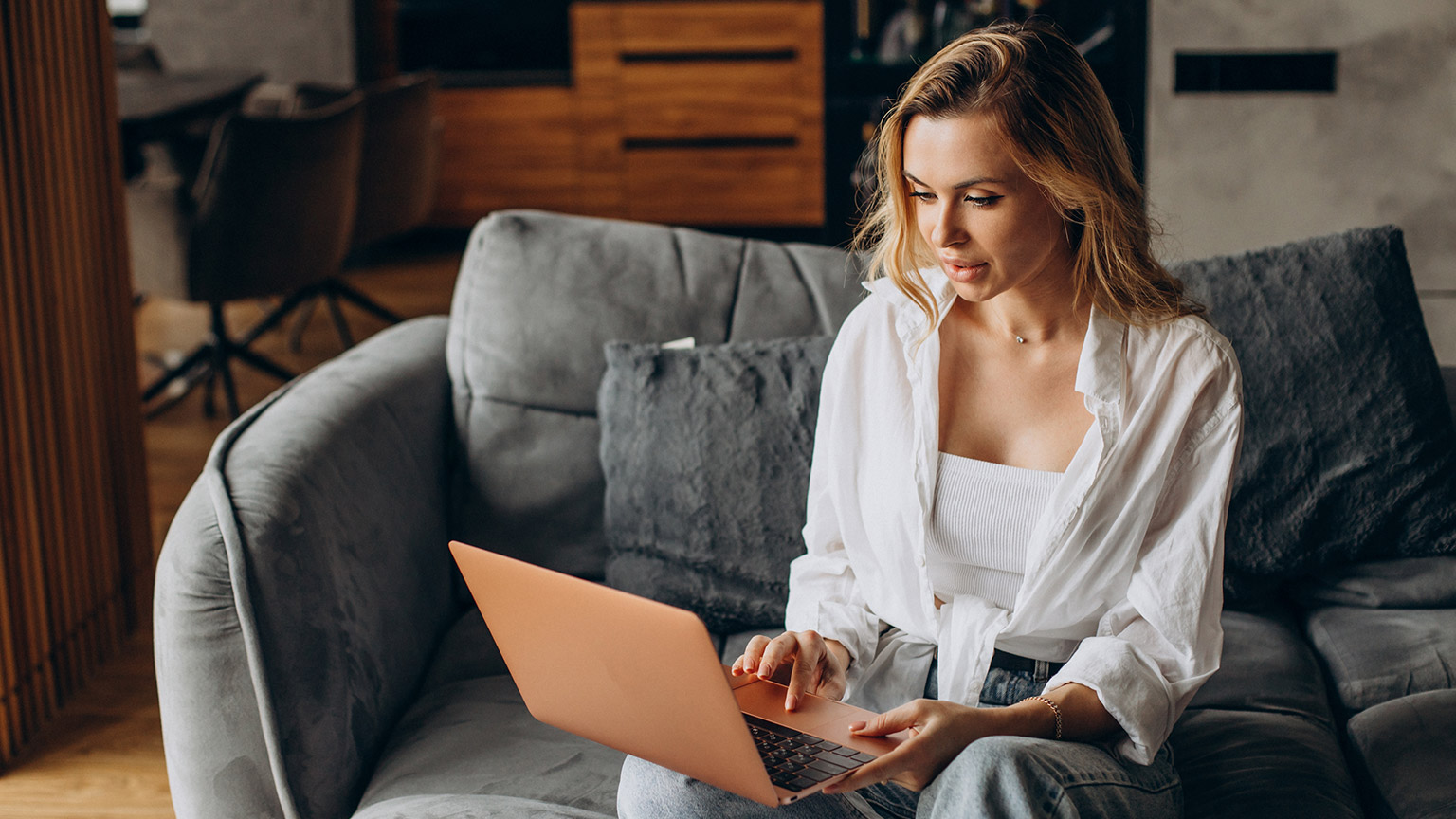 A person reading information on a laptop