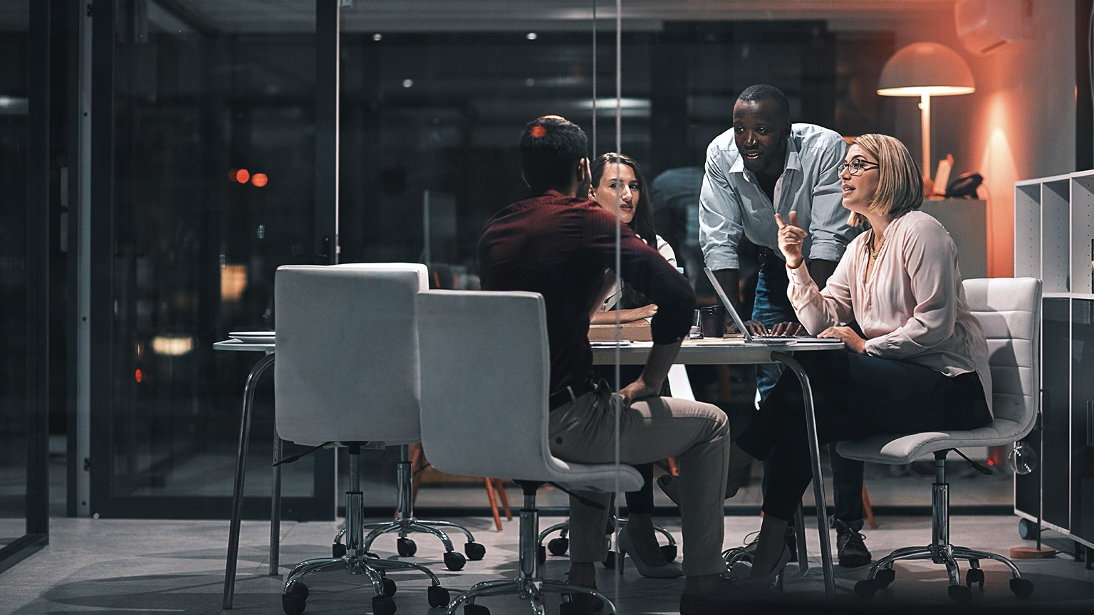 A business group discussing work in an office