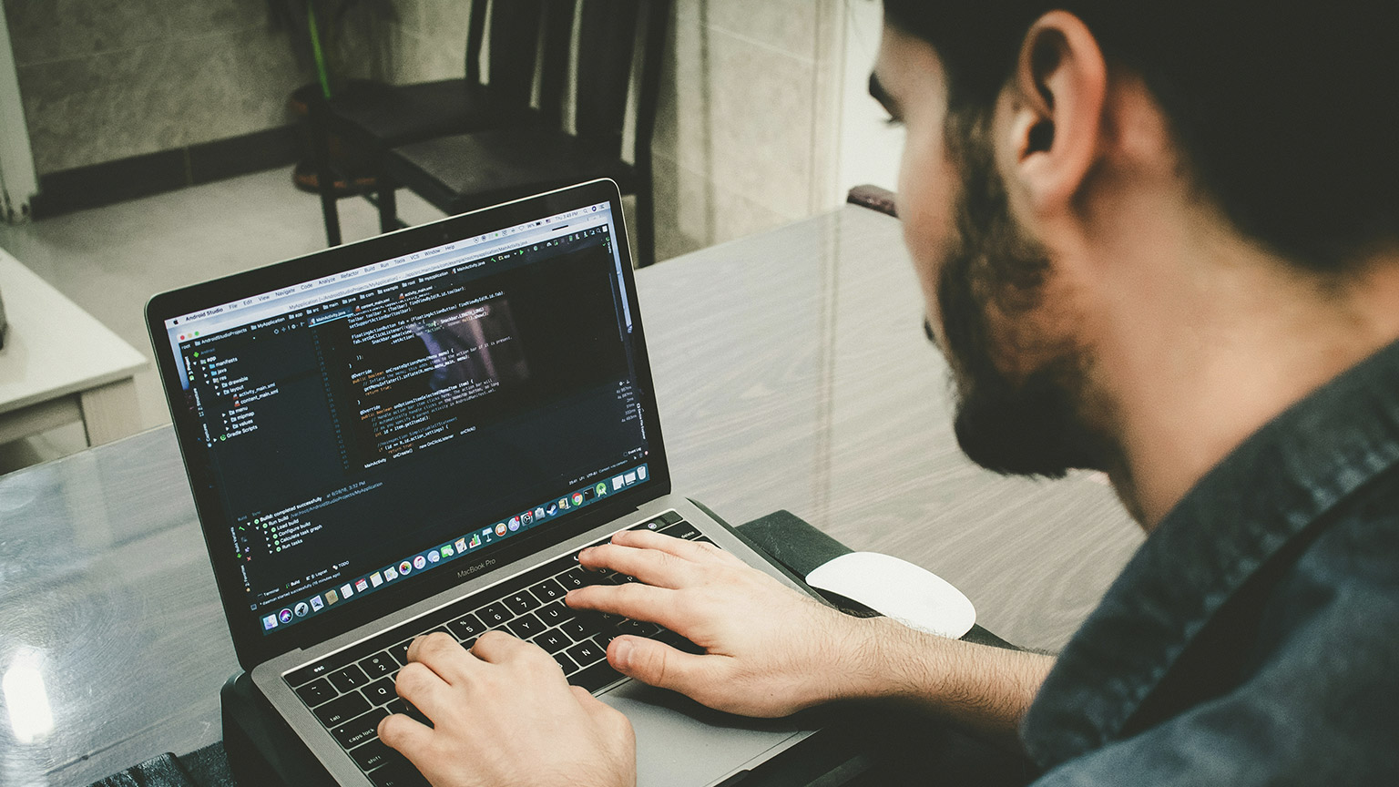 A person working with code on a laptop