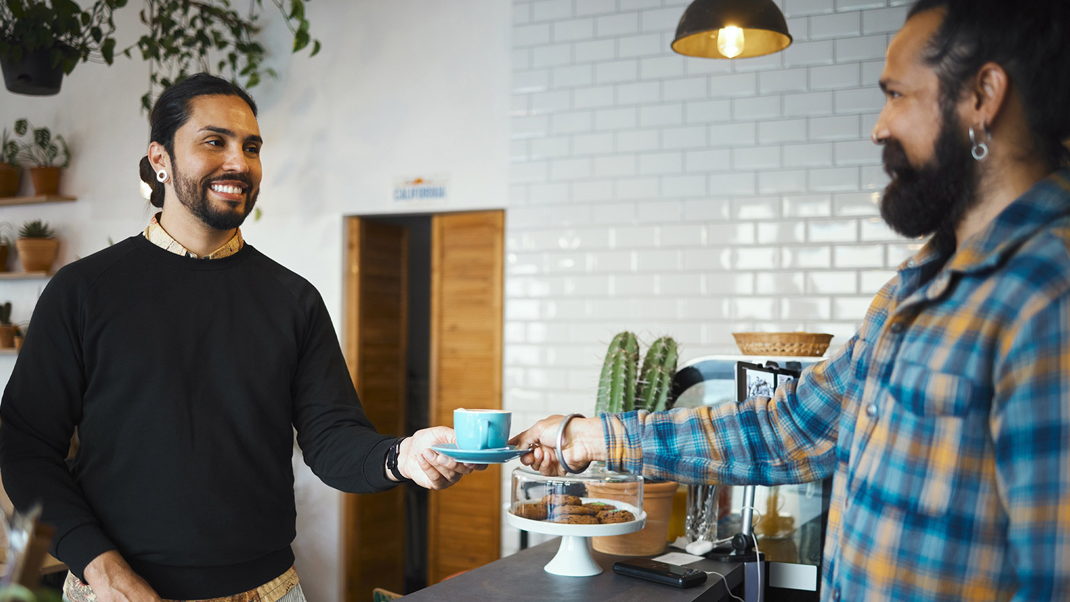 A barista serving a customer