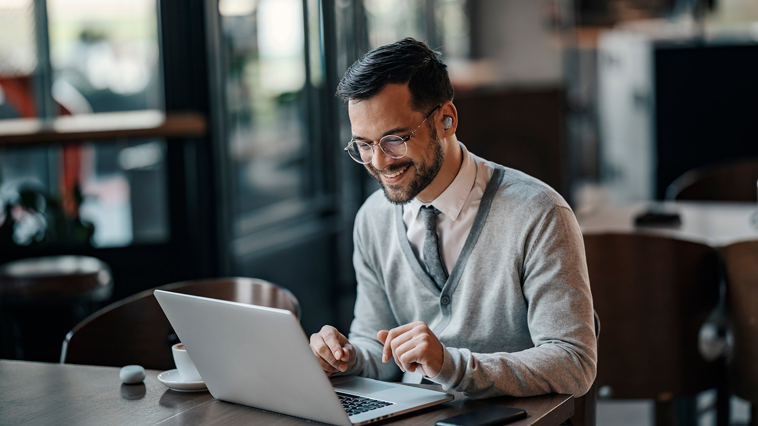 A person working on an email on a laptop