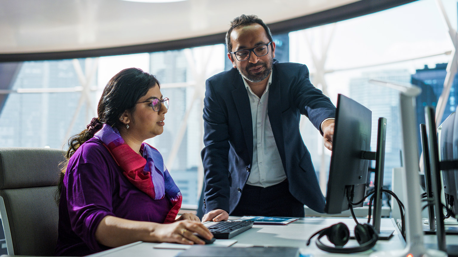 Work colleagues discussing financial matters in an office