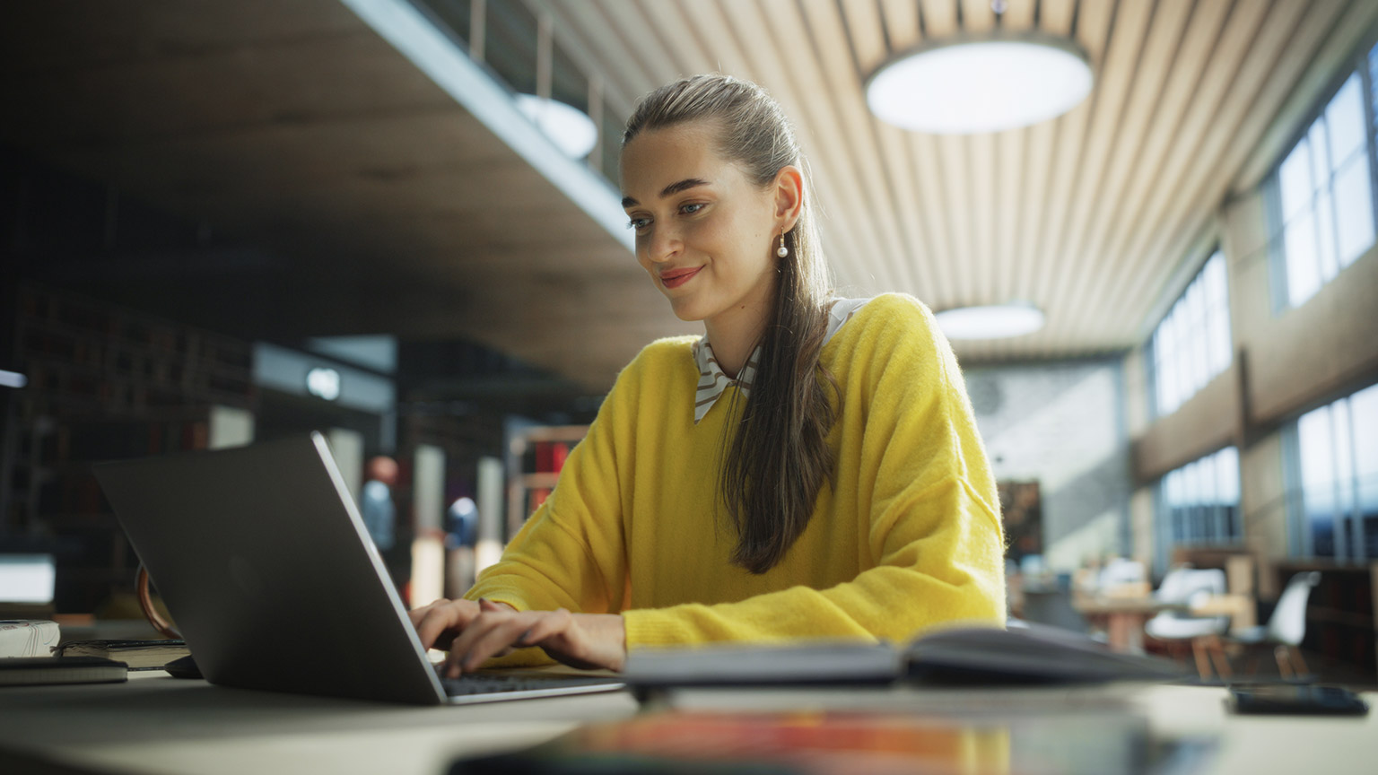 A person reading information on a laptop