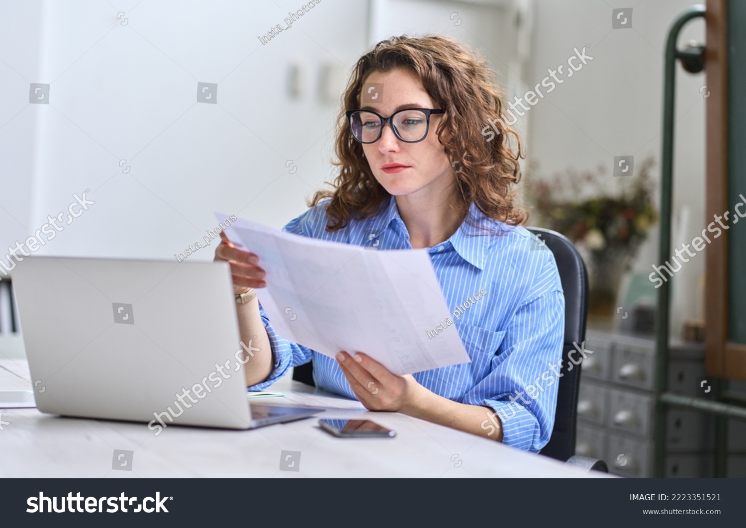 employee holding documents 