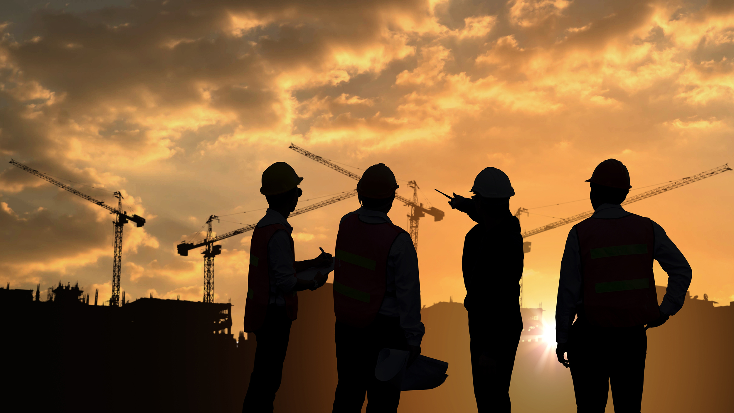 Silhouette of people on a construction site