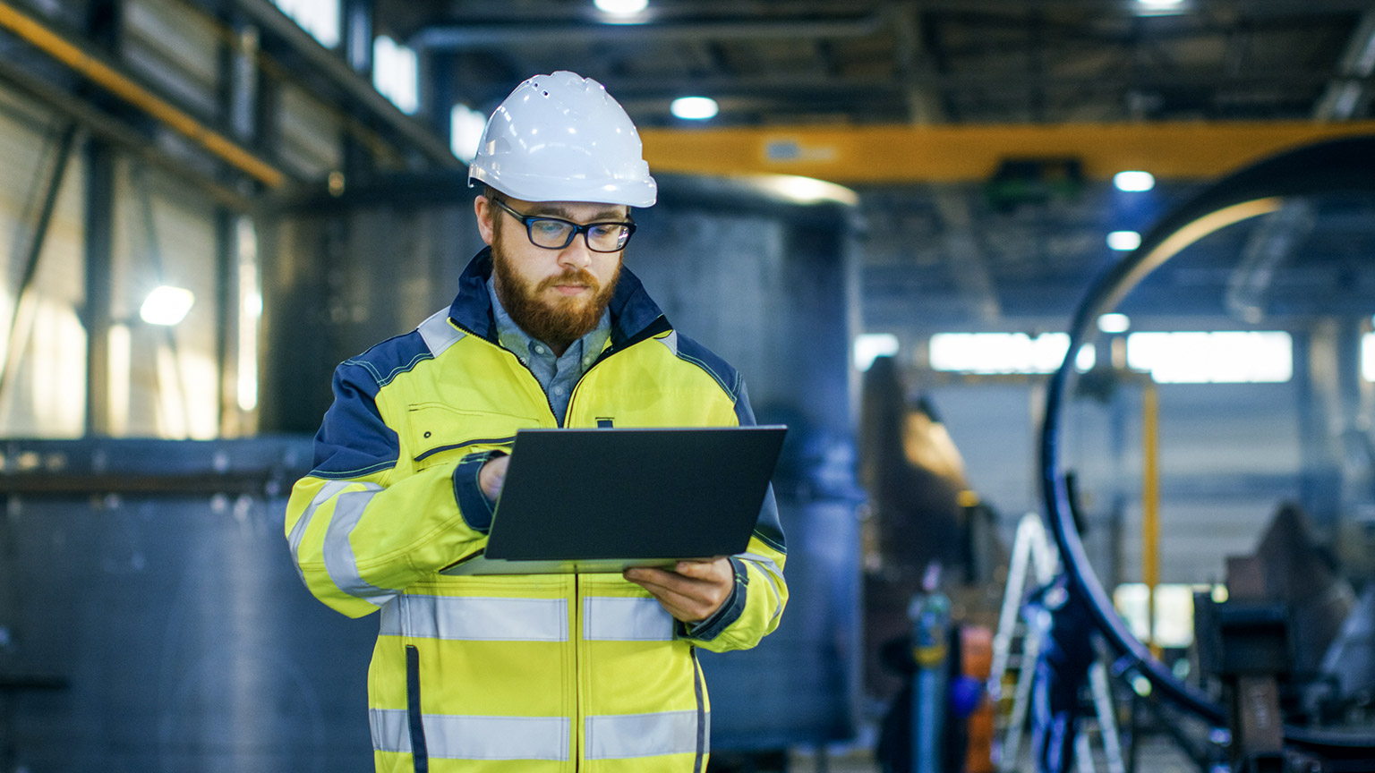 Industrial Engineer in Hard Hat Wearing Safety Jacket