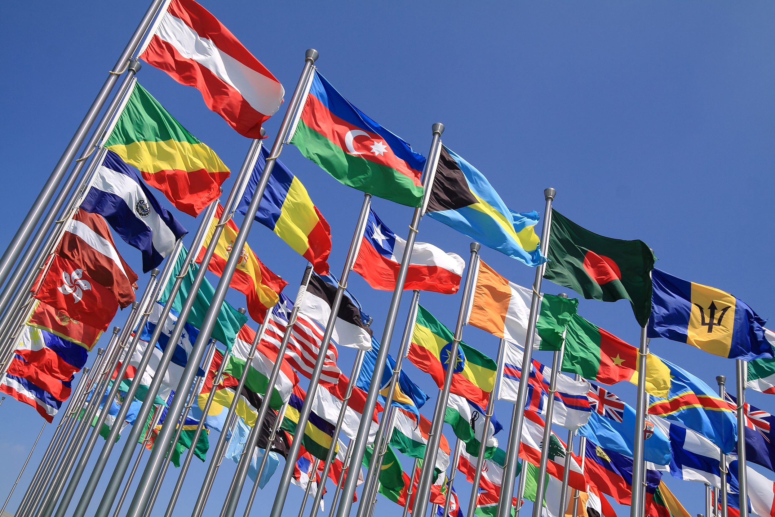 Flags of multiple countries on flag poles