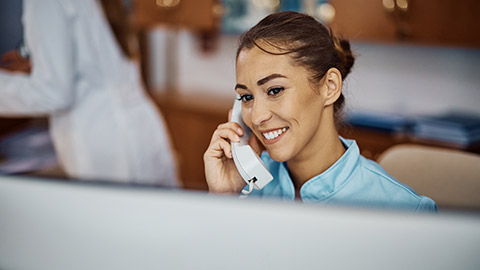 young nurse answering phone call