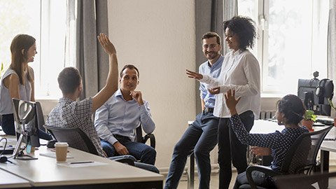 people discussing sharing ideas together in office at meeting