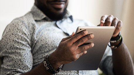 A person reading on a tablet