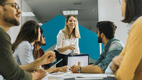 team leader talking with group of people in the office