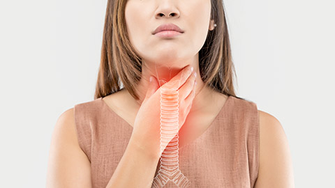 woman holding on her neck with trachea graphics