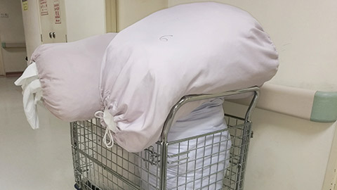 dirty linen in trolley at hospital