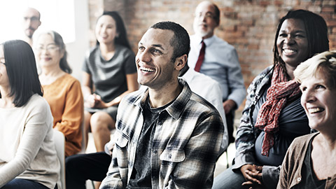 Happy audience watching presentation