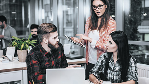 Woman giving advise to colleagues