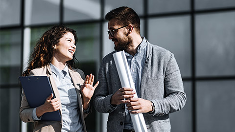 Office man and woman on discussion outdoor