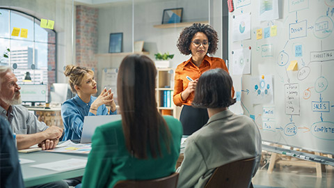 Female Digital Entrepreneur Uses Whiteboard with Big Data, Statistics, Talks about Company Growth