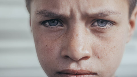 A close view of an upset child