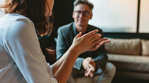 people discussing in office lounge