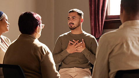 Support, trust and man sharing in group therapy with understanding, feelings and talking in session