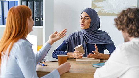 Lively conversation of office workers during a coffee break