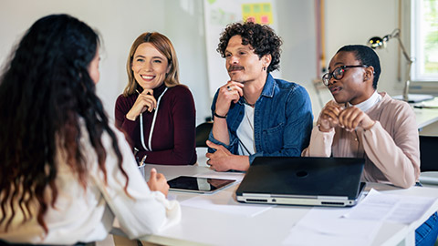 Human resources managers conducting job interviews with applicants in the office