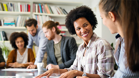 Group of business people collaborating on project in office