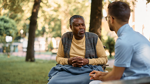 A carer and client outdoors