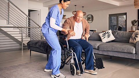 A carer assisting an elderly client