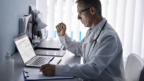 doctor physician using laptop tech in hospital office