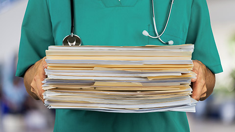 Doctor holding Medical Files