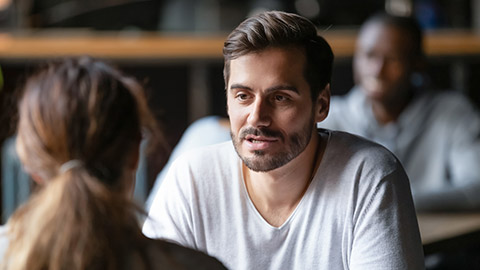 man having conversation with woman girlfriend sit at cafe table