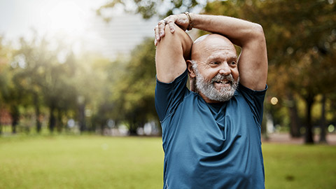 Stretching, fitness and running with old man in park for health