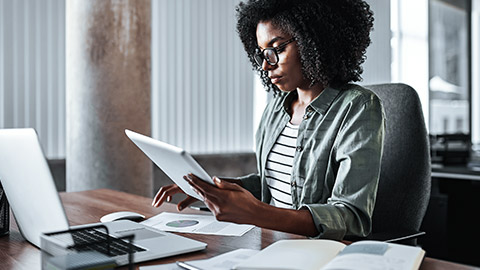 Woman analyzing business report