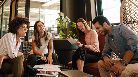 Man and women sitting together in modern office for project discussion