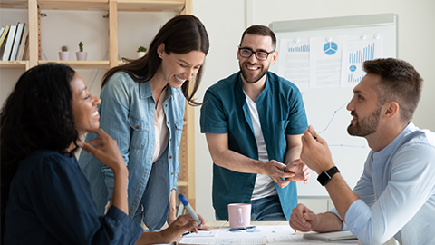 colleagues gather in boardroom brainstorm