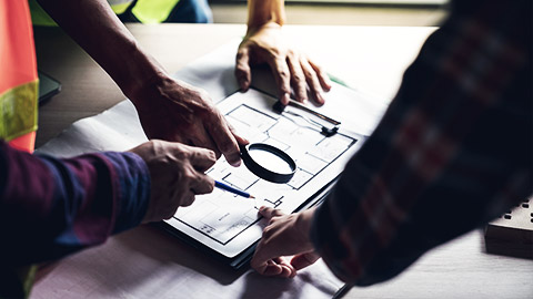 A group of planners identifying risks in a workplace deisgn