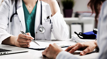 Doctor consulting patient hands closeup