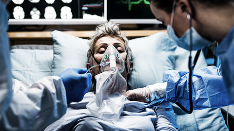 Infected patient in quarantine lying in bed in hospital, coronavirus concept.