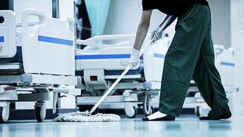 person cleaning the hospital floor