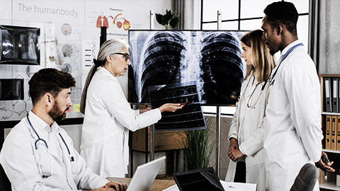 A group of doctors discussing bone xray