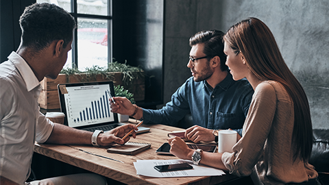 business people analyzing data using computer