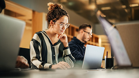 woman looking at her laptop