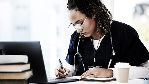 A medical person taking down notes