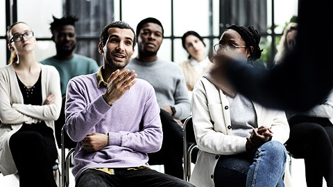 A WHS officer teaching employees of a company some safety guidelines