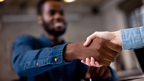 Business people shaking hands.