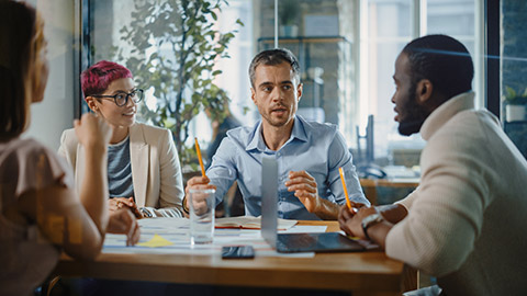 Office Meeting in Conference Room: Handsome Specialist Talks about Firm Strategy