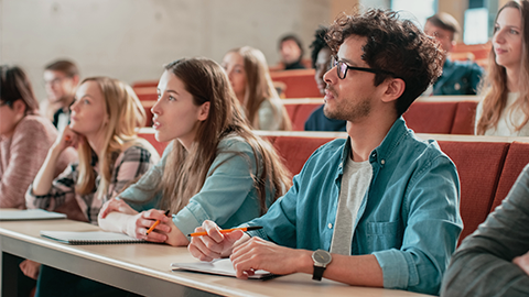 In the Classroom Multi Ethnic Students Listening to a Lecturer