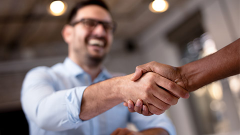 Business people shaking hands.