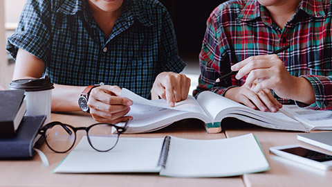 Students studying in the classroom during the lecture.